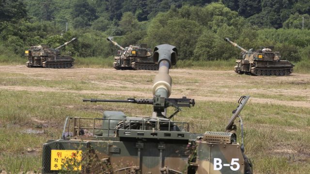 South Korean army's K-55 self-propelled howitzers are at positions during a military exercise