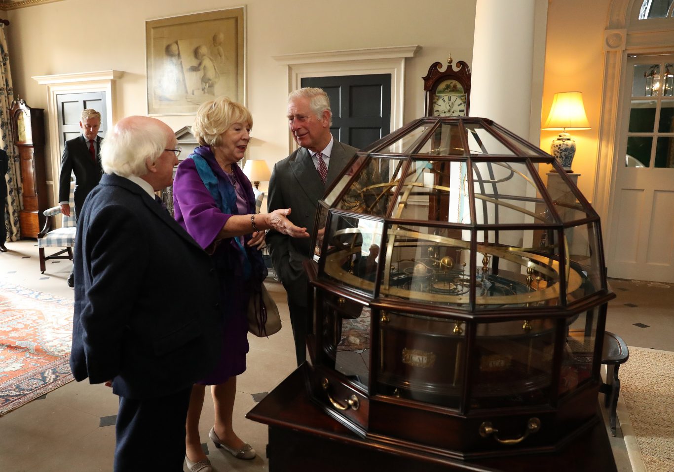 The Prince of Wales,  President of Ireland and his wife Sabina view the Grand Orrery, an 18th century mechanical model of the solar system (Andrew Milligan/PA)