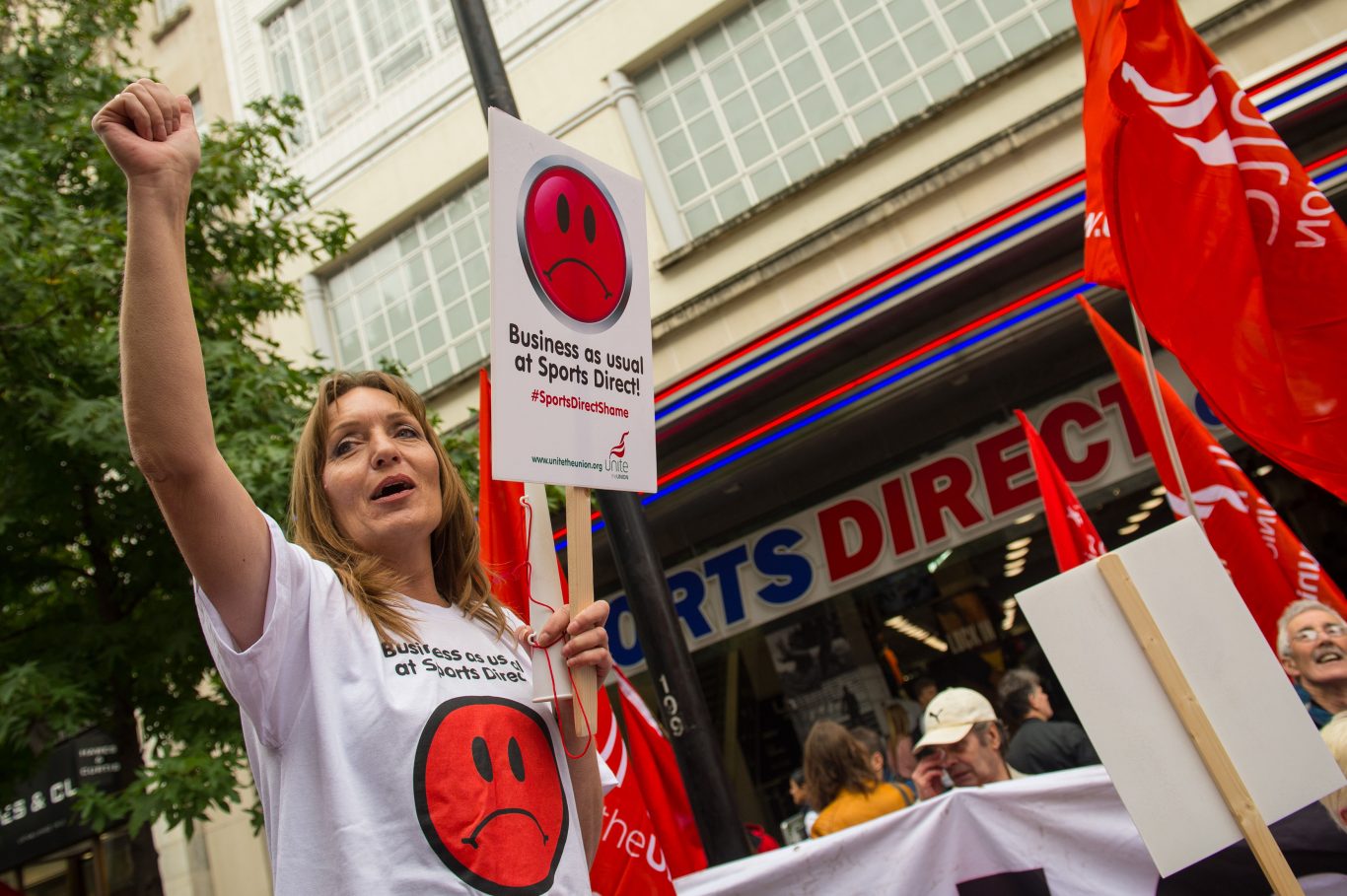 Protests outside the Sports Direct store in London as the troubled retailer has been accused of reneging on a promise to offer guaranteed hours to staff on zero hour contracts in a fresh blow to the company ahead of its annual meeting  (Dominic Lipinski/PA)