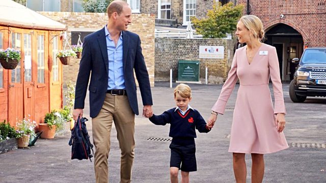 Prince George is led into school by the Duke of Cambridge and head of the lower school Helen Haslem