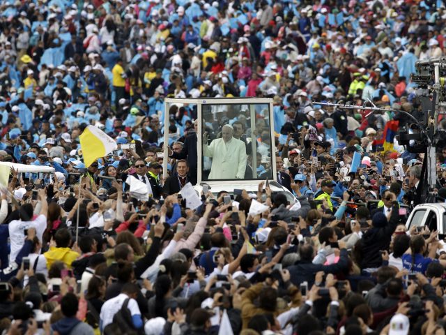 The Pope waves to crowds in Bogota 