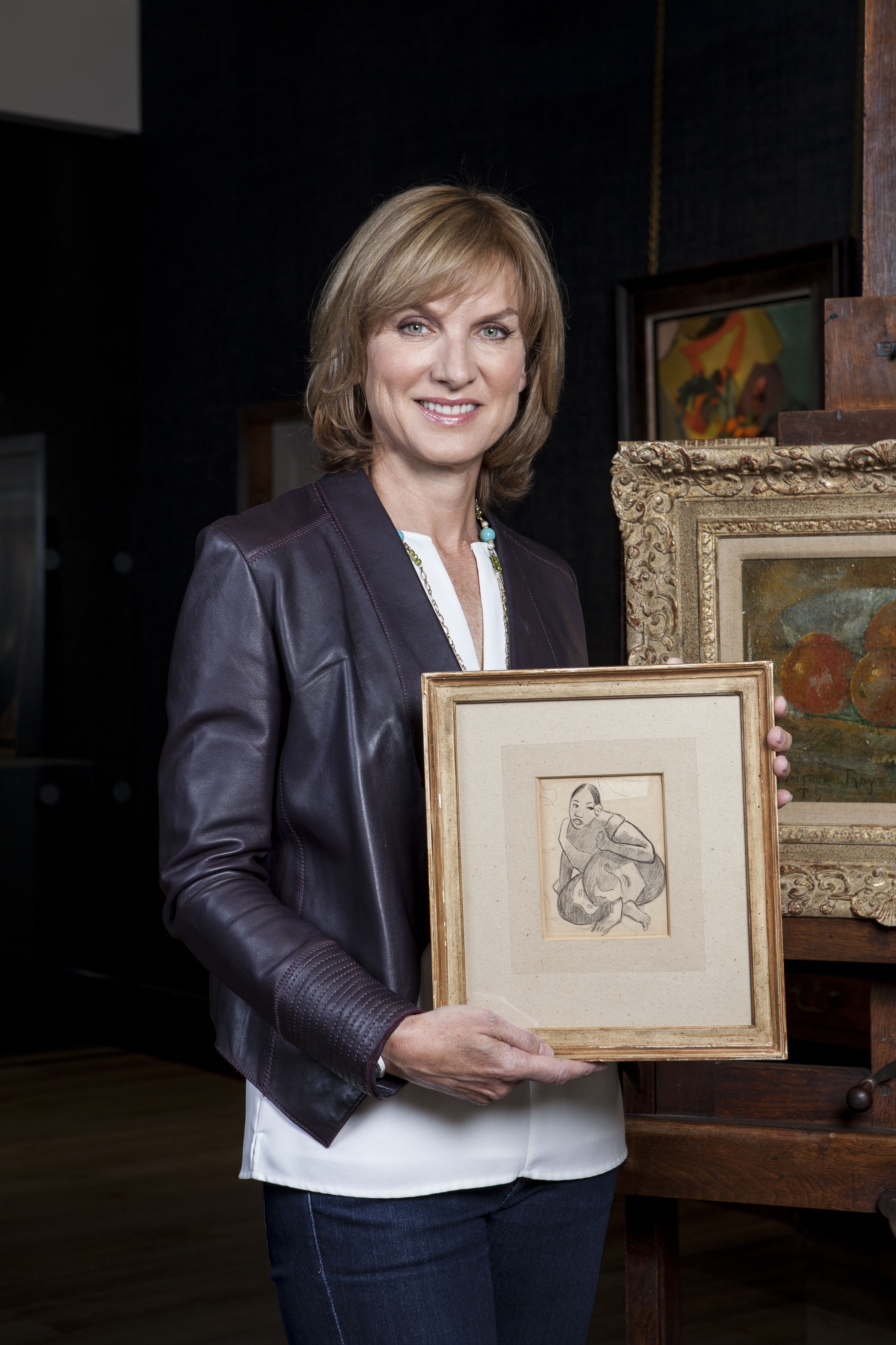 Fiona Bruce demonstrates the pricey painting.