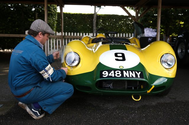 A mechanic works on a 1958 Lister Jaguar  