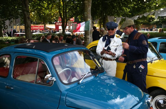 Enthusiasts admire a Fiat 500 (Andrew Matthews/PA)
