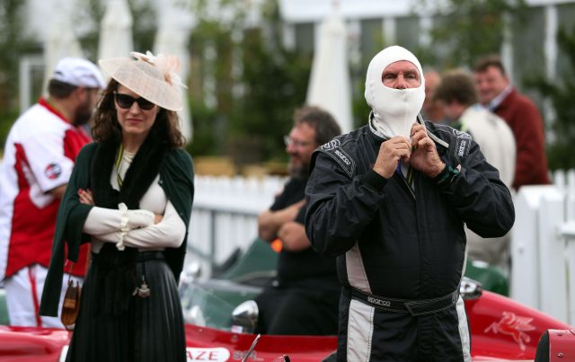 A driver puts on his fire protection hood before the Richmond Trophy (Andrew Matthews/PA)