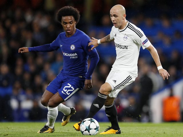 Richard Almeida, right, challenges for the ball with Chelsea's Willian during the Champions League group C match at Chelsea