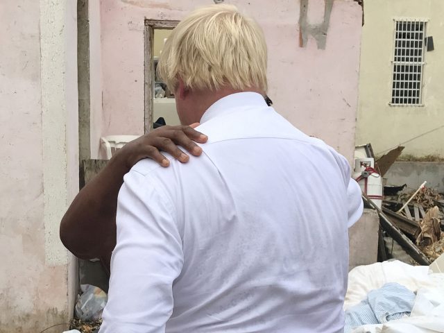 Dorothy Nibbs is comforted by Boris Johnson