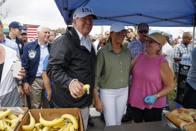 President Donald Trump and first lady Melania Trump talk and hand out food to people impacted by Hurricane Irma at Naples Estates (Evan Vucci/AP)