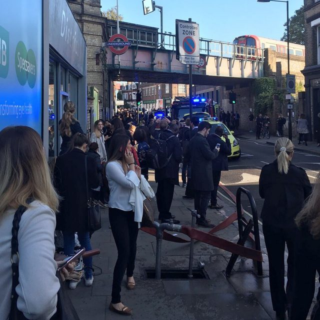 People watch as the emergency services deal with an explosion at Parsons Green