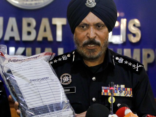 Kuala Lumpur police chief Amar Singh displays evidence 