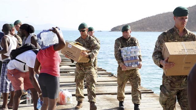 Royal Marines deliver aid and provide support to the islanders after Irma. (MoD/PA/AP)