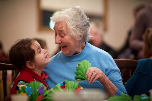 Nancy Cox, six, from 1st Northenden (St Wilfrid's) Rainbows, with 82-year-old Jean Feltham