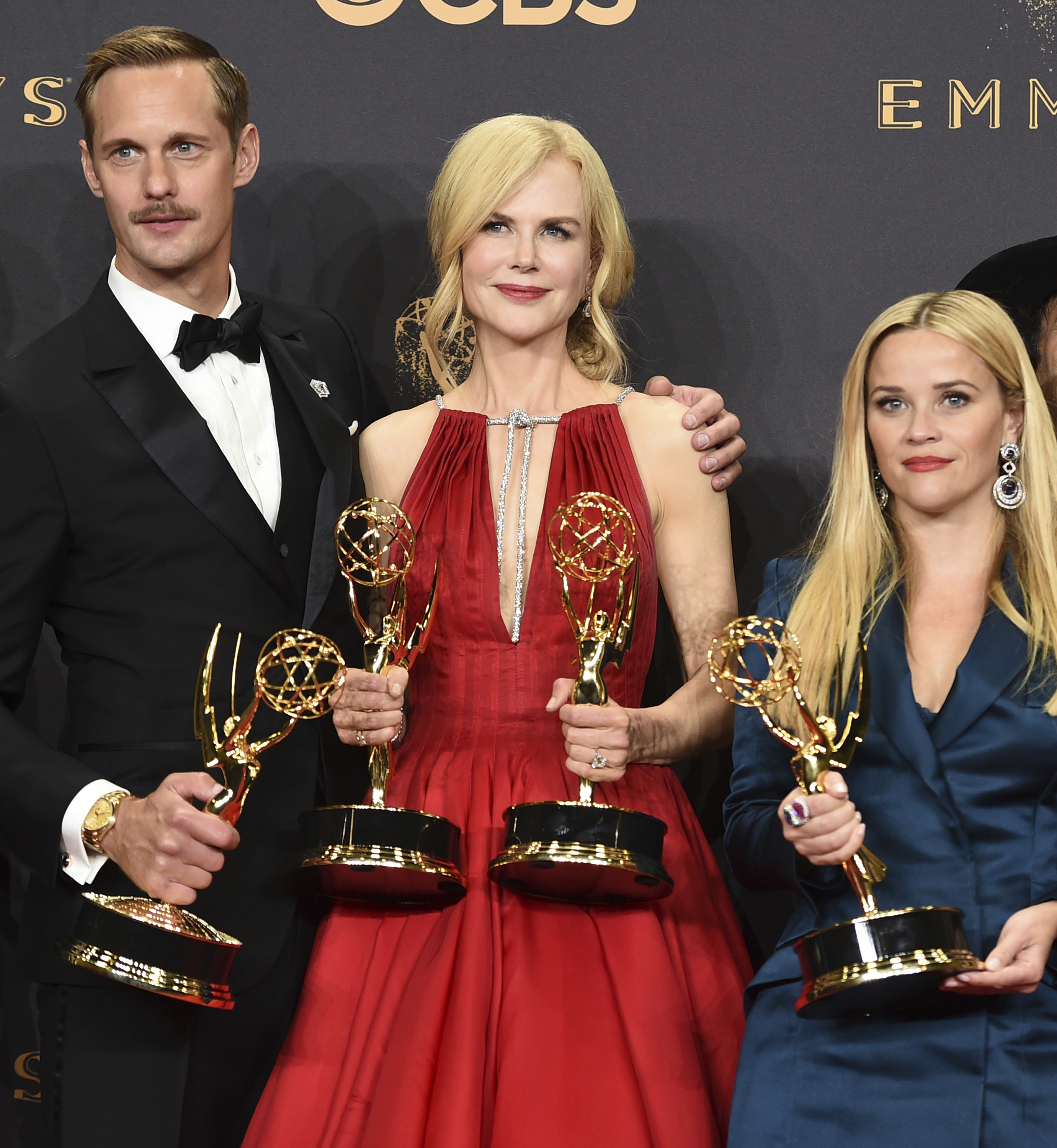 Alexander Skarsgard, Nicole Kidman, and Resse Witherspoon pose with their awards (Jordan Strauss/Invision/AP)