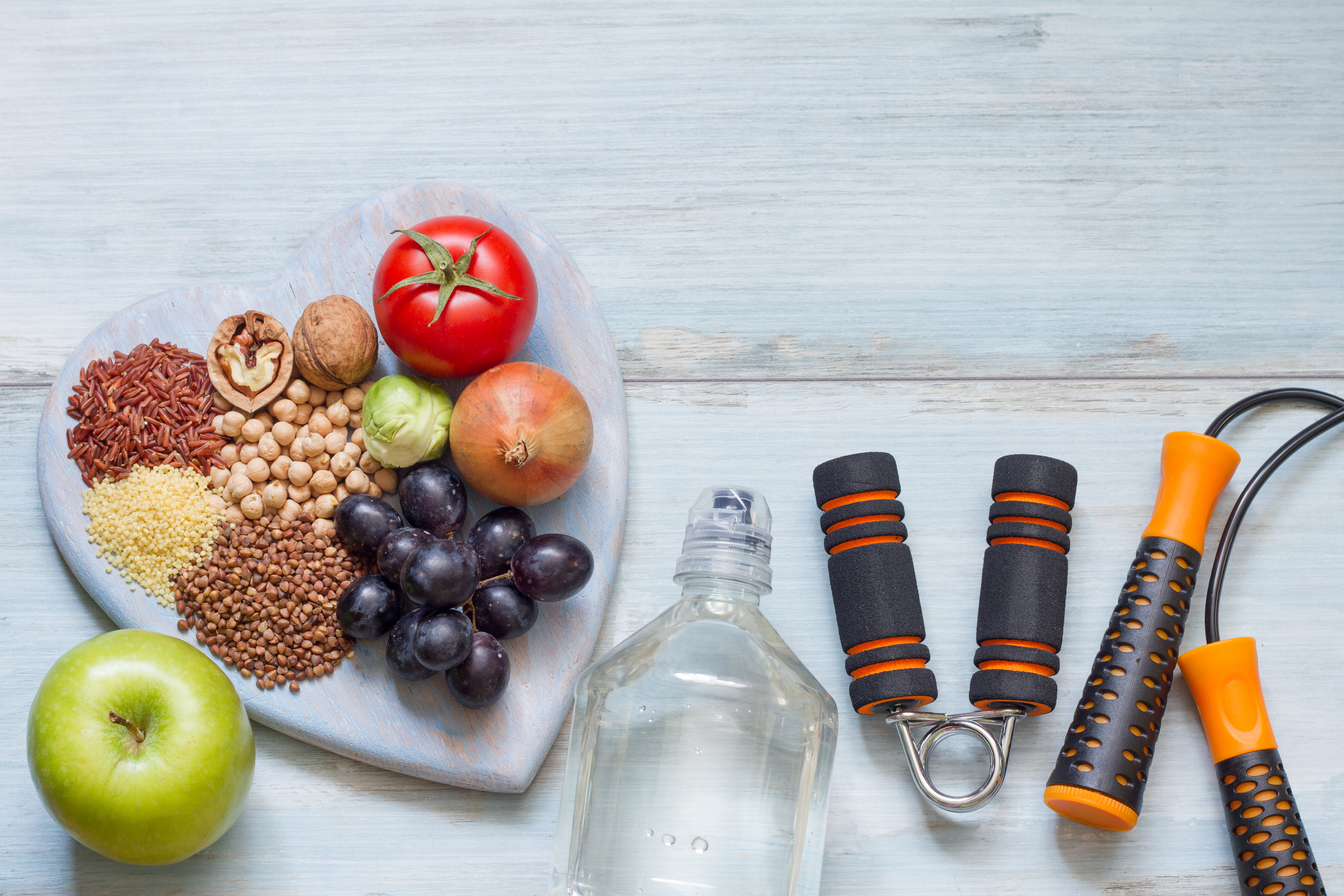 Generic photo of a plate of fresh fruit and nuts plus exercise equipment (Thinkstock/PA)