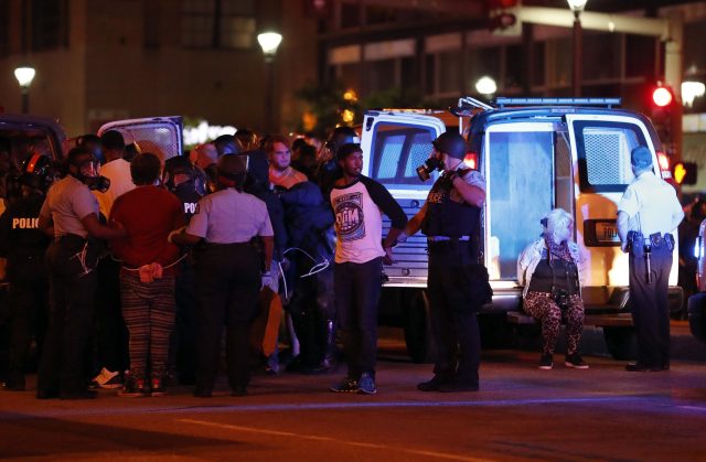 Police make multiple arrests after the peaceful protest turned violent (Jeff Roberson/AP)