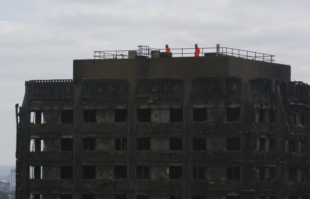 Emergency services personnel on top of Grenfell Tower