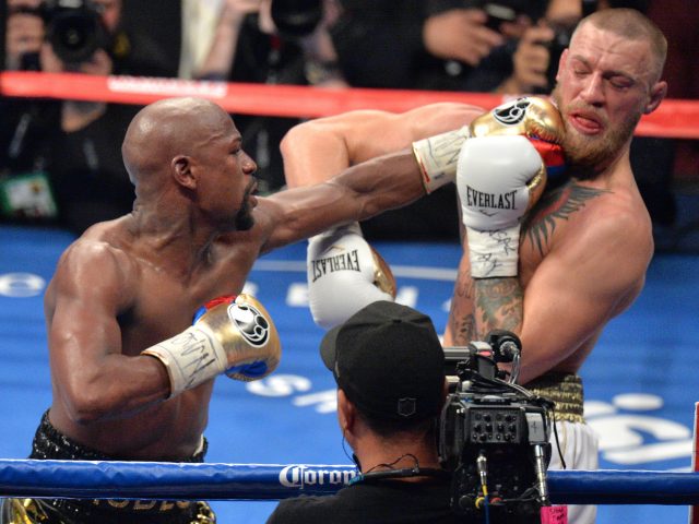 Floyd Mayweather Jnr and Conor McGregor during their fight at the T-Mobile Arena