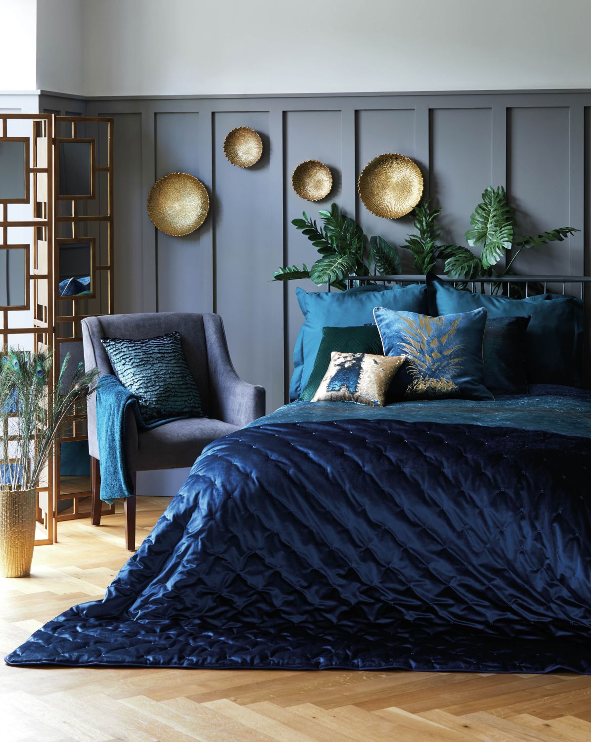 Colonial Charm range: mirrored screen, £120; ceramic gold plates from £9-£15; faux cheese plant leaf team, £1.49; (chair) Chenille throw, petrol blue, £16; Valentina velvet duvet set, from £34-58; two tone teal sequin cushion, £10; pineapple foil cushion, £20; velvet bedspread, teal, from £65, Dunelm (Dunelm/PA)