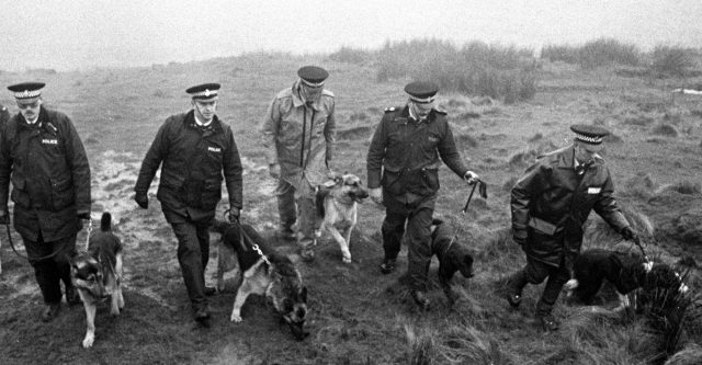 Police using sniffer dogs on Saddleworth Moor to search for Keith Bennett, one of the victims of moors murderer Ian Brady, in 1986 (PA)