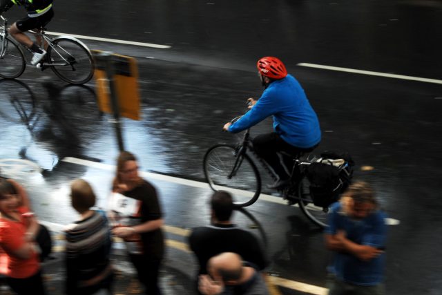 A cyclist makes his way to work