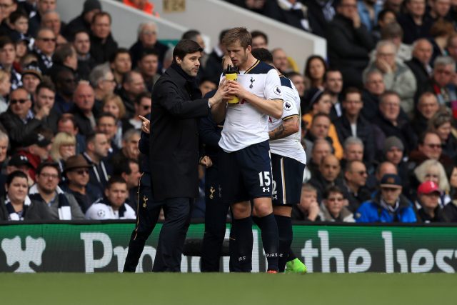 Eric Dier gets instructions from Mauricio Pochettino