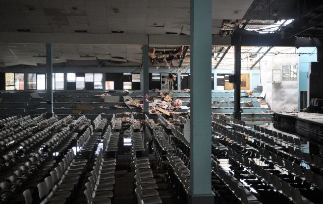 Sir Rupert Briercliffe Hall is flooded after Hurricane Maria dumped rain through a hole in the roof that Hurricane Irma tore off the previous week in Road Town, Tortola island, on the British Virgin Islands (Freeman Rogers/AP)