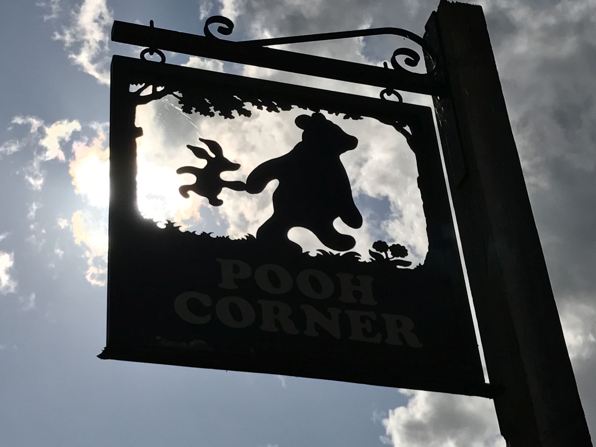 The Pooh Corner shop sign at Hartfield (Hannah Stephenson/PA)