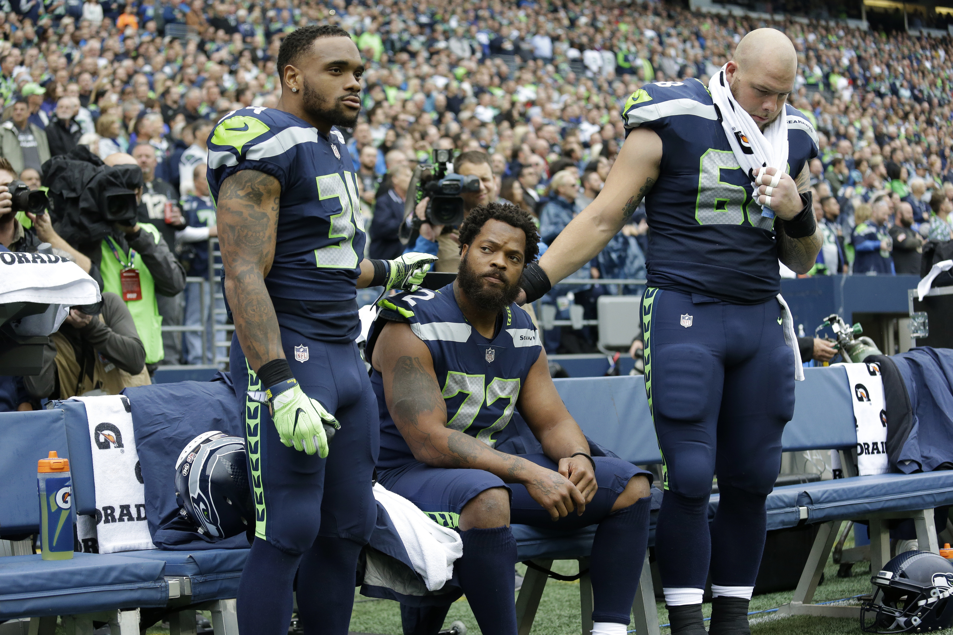 Bennett sits during the national anthem on August 17