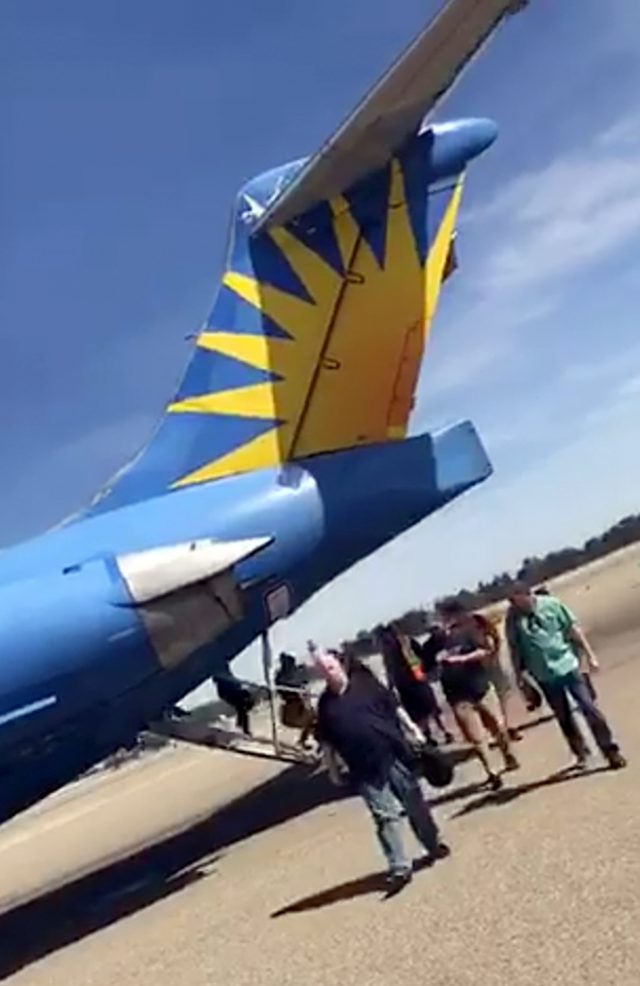 Mobile phone video shows passengers leaving an Allegiant Air jet