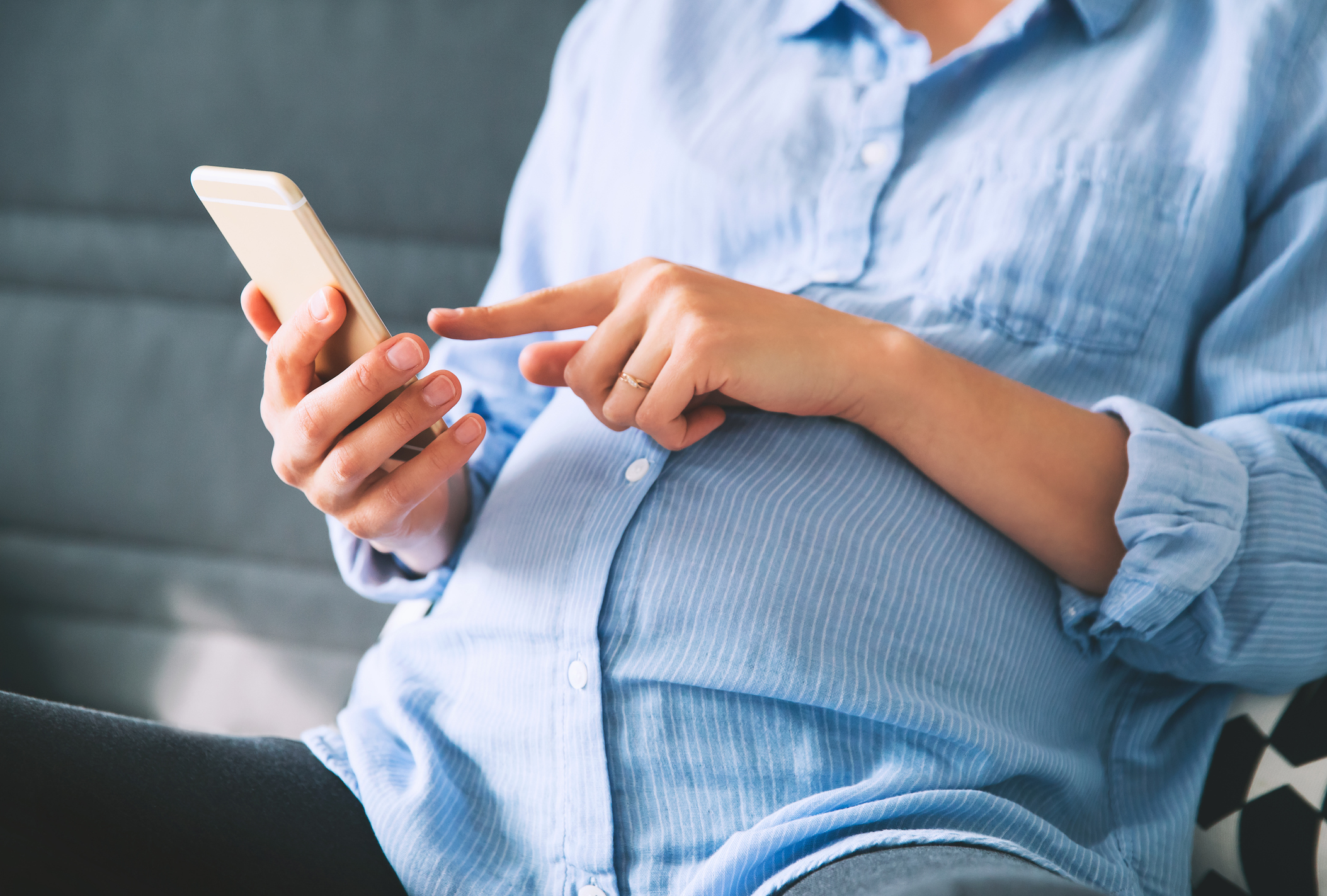 A pregnant woman holding her mobile phone (Thinkstock/PA)