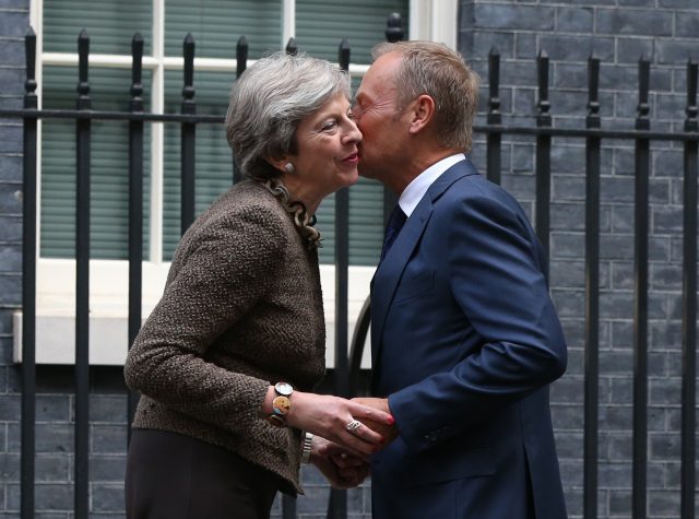 Theresa May greets Donald Tusk at 10 Downing Street (Jonathan Brady/PA)