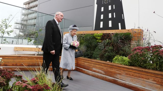 Reverend James Falconer shows Queen Elizabeth II the Robertson Family Roof Garden during a visit to Aberdeen Royal Infirmary