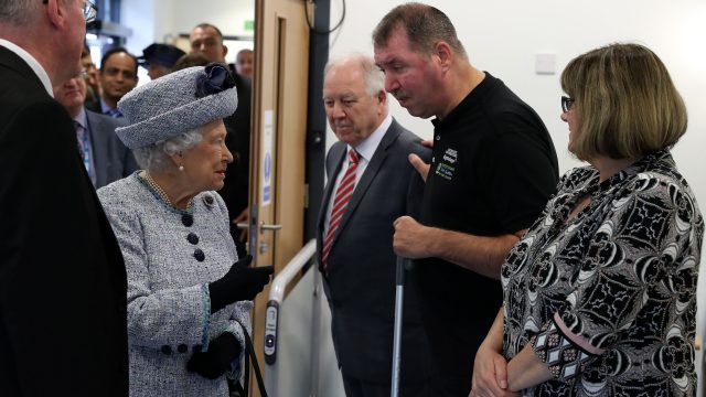 The Queen talks with patient and fundraiser Paul Breen and his wife Liz, during a visit to Aberdeen Royal Infirmary