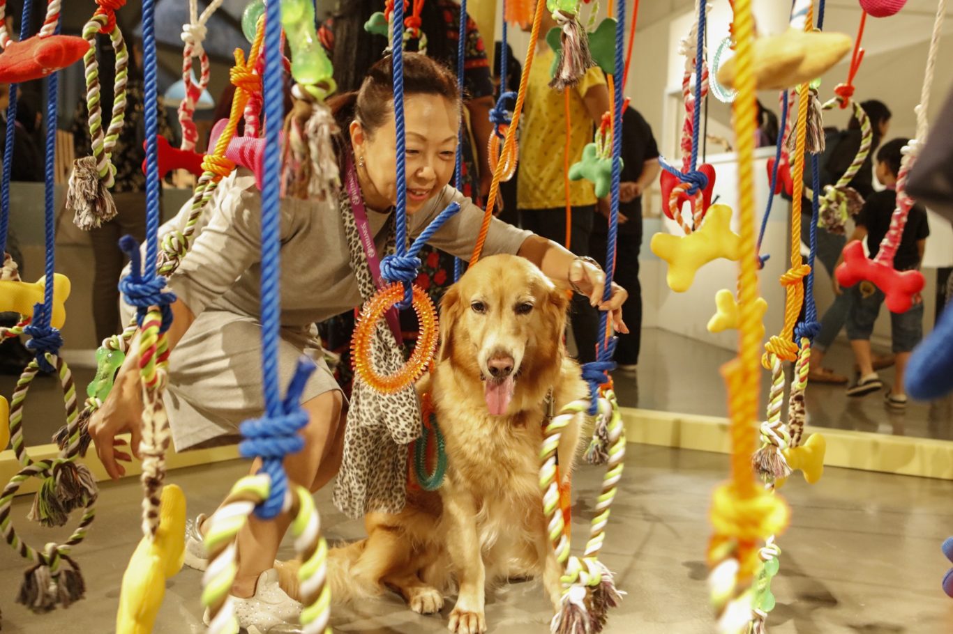A dog and his owner experience the "Heartstrings" installation by Jes & Jalon (Wellness/PA)