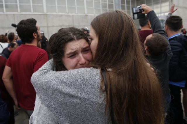 A woman cries after civil guards dragged people away