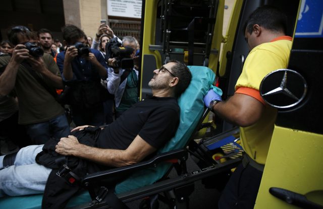 An injured man is taken into an ambulance