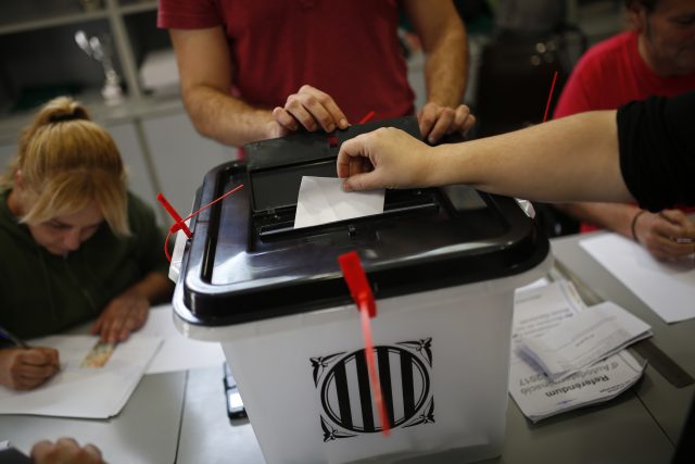 A woman casts her vote