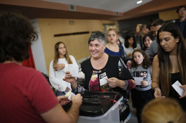 A woman prepares to cast her vote