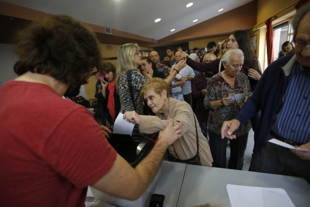 A woman casts her vote