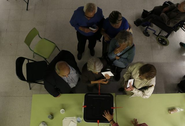 Voters wait to cast their ballots