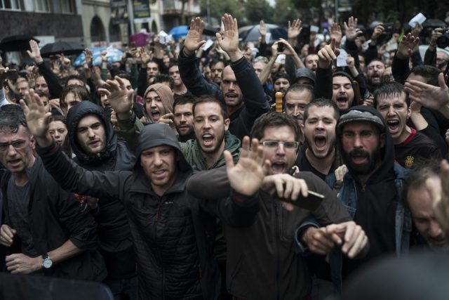 People confront Spanish riot police