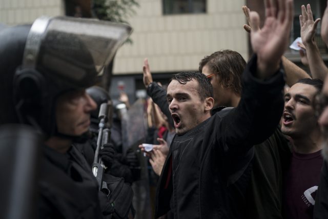 People confront Spanish riot police