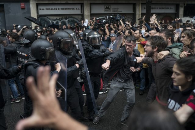 People confront Spanish riot police