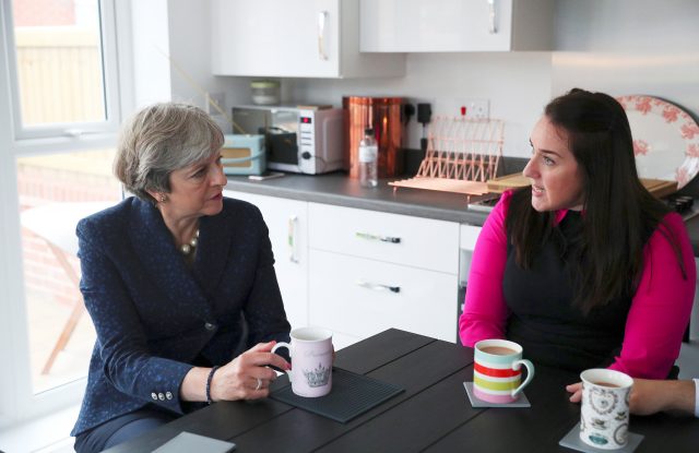 Prime Minister Theresa May visits the home of Rebecca Coulton, who bought a starter home using the Government’s Help to Buy scheme, in Walkden, Salford, during the Conservative Party conference in Manchester (Hannah McKay/PA)