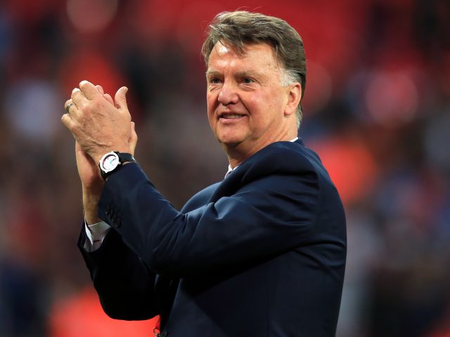 Manchester United manager Louis van Gaal acknowledges the support from the fans