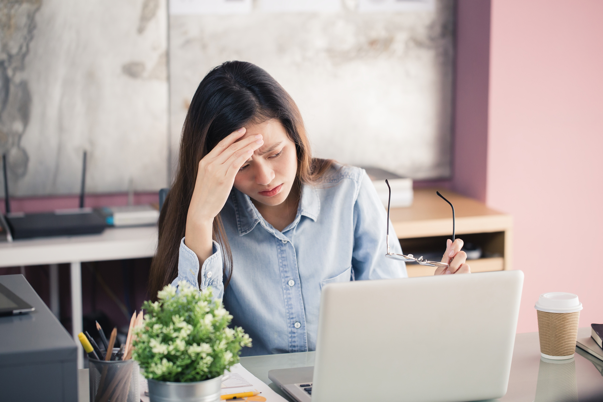 Anxious woman at her desk (Thinkstock/PA)