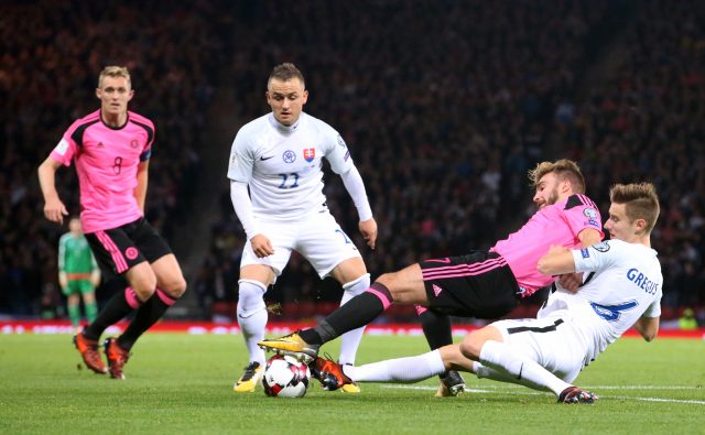 James Morrison is tackled against Slovakia