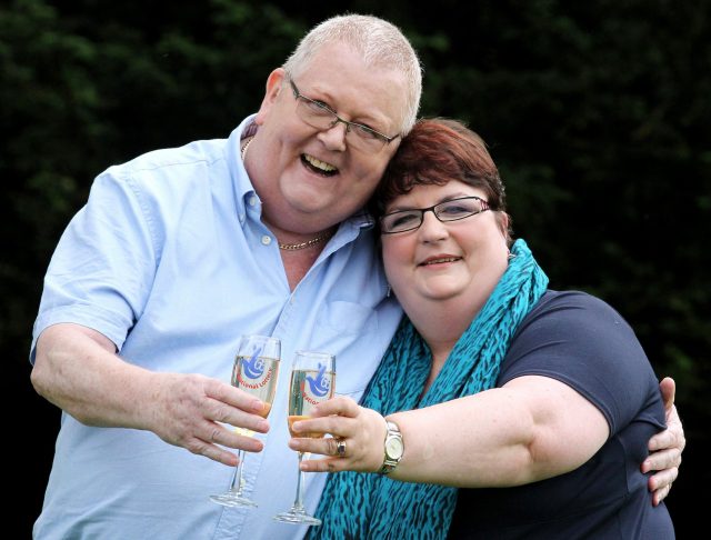 Colin and Chris Weir toast their win in 2011 (Andrew Milligan/PA)