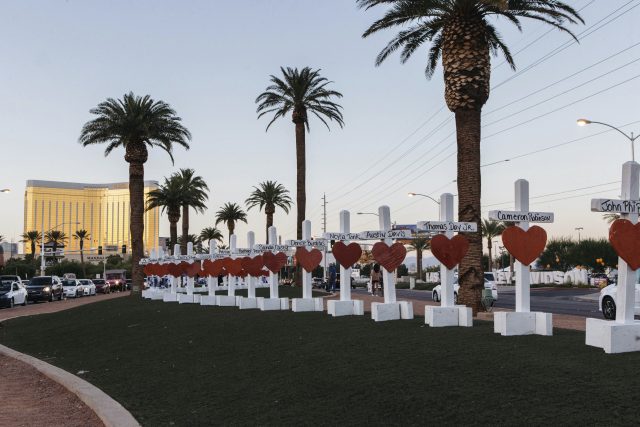 A memorial displaying 58 crosses near the Welcome To Las Vegas sign