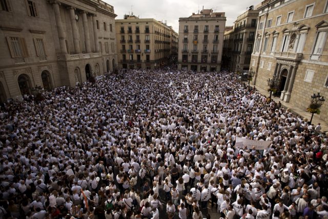 People gather during a protest in favour of talks and dialogue in Barcelona